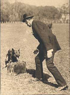 Vintage KNPV-style training photograph — handler working a Belgian Malinois through obedience and bite-work drills